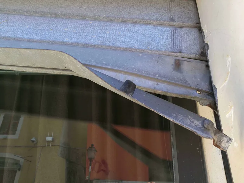Damaged roller shutter curtain requiring repair